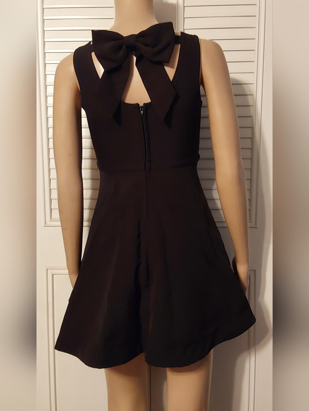 Classic Black V-Neck Sleeveless Mini Dress with Flared Skirt